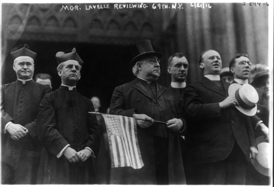 Mgr. Lavelle (holding U.S. flag) reviewing 69th Regiment, N.Y. LCCN2003688527