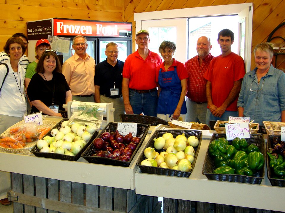 Michael Taylor and colleagues visit the farm stand owned by the Spear family in Waldoboro