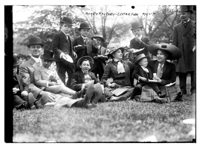 Midgets May Party - Central Park. Group seated on grass. LCCN2014688121