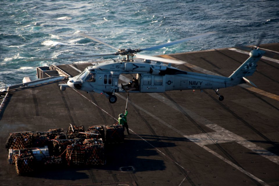 MH-60S Sea Hawk transports cargo 140110-N-RY581-123