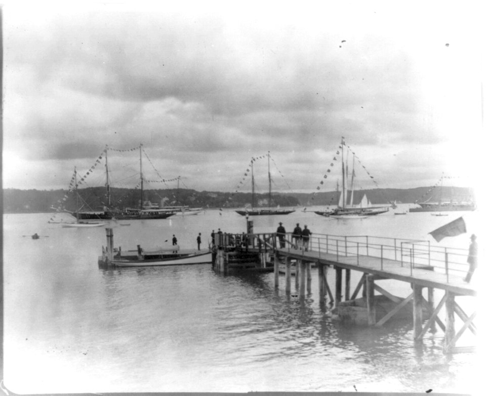 New York - Oyster Bay, Long Island Yacht Club- looking past pier to sailing yachts at anchor LCCN2006679208