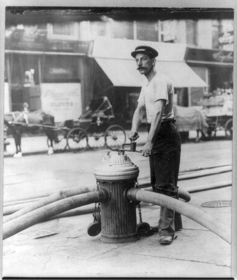 New York City fireman turning on high pressure hoses at hydrant. July 1908 LCCN2007682983