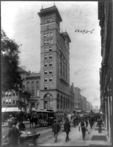 New York (City). View toward Shoe & Leather Bank; busy street scene of pushcarts, wagons, and horse-drawn trolley LCCN2007683147