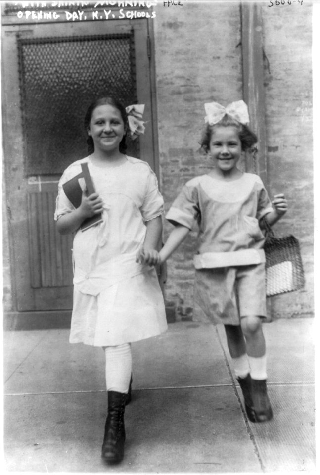 New York City school children. 2 girls with shining faces, opening day, Sept. 1915 LCCN2006675675