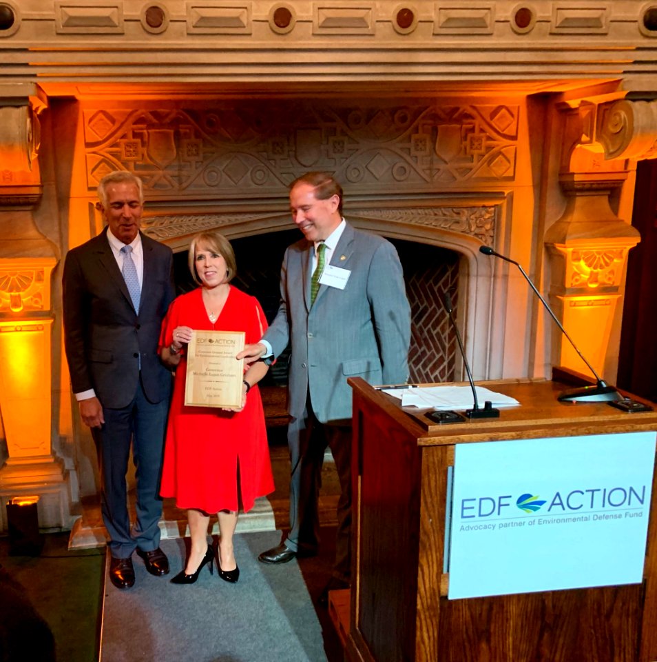 Michelle Lujan Grisham receives EDF award from Tom Udall in 2019