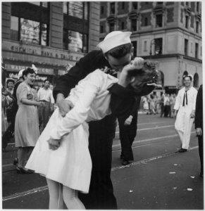 New York City celebrating the surrender of Japan. They threw anything and kissed anybody in Times Square. - NARA - 520697