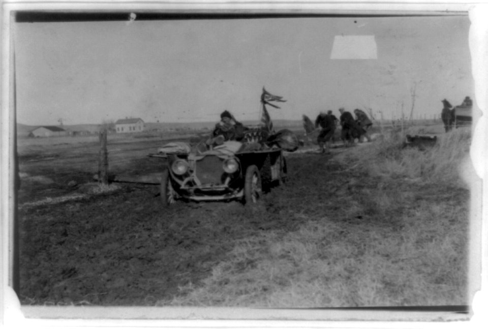 New York to Paris automobile race - five men trying to pull automobile out of mud LCCN96509133