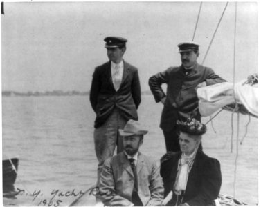 New York Yacht Club, Oyster Bay, L.I., 1905- 2 men with man and woman watching yacht race LCCN2006675572