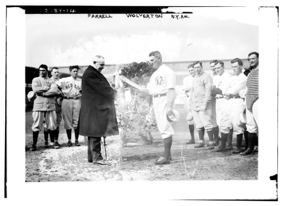 New York Yankees president Frank Farrell presents loving cup to Yankees manager Harry Wolverton as Red Sox and Yankees players look on at Hilltop park, New York, April 11, 1912 (baseball) LCCN2014690316