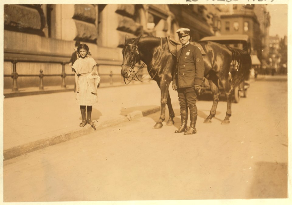 Newsgirl, Park Row. Against the law, but 'who cares.' LOC cph.3a47670