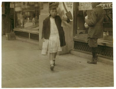Newsgirl about 11 years old, with a single paper making a begging and sight seeing trip through the business section. See California report. LOC nclc.03960