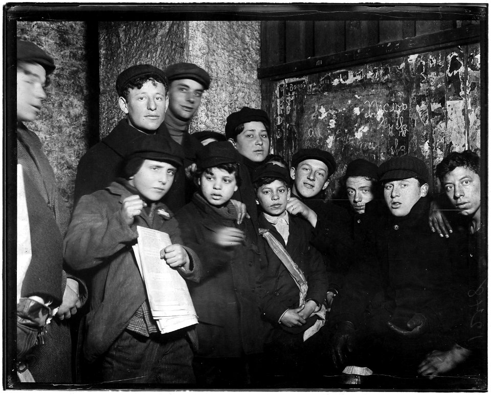 Newsies in cellar-room of a paper office in alley back of Main St. waiting for evening papers, 4 P.M. Conditions here... - NARA - 523276
