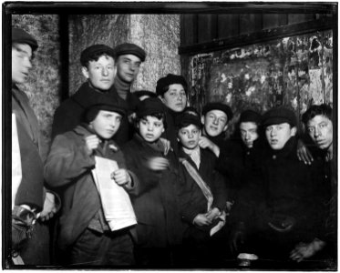Newsies in cellar-room of a paper office in alley back of Main St. waiting for evening papers, 4 P.M. Conditions here... - NARA - 523276