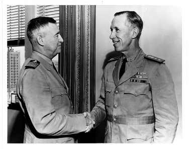 NH 43095 Rear Admiral Walter S. Anderson, USN, greeted by Captain H.H.J. Benson, USN, July 1944