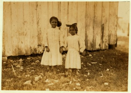 Mildred Kron, three years old, and Gertrude Kron, five years old. Help shuck oysters every day in the Barataria Canning Co. Live in New Orleans, (See also photos 1973, 1976, 1977, 1997, LOC cph.3a01061