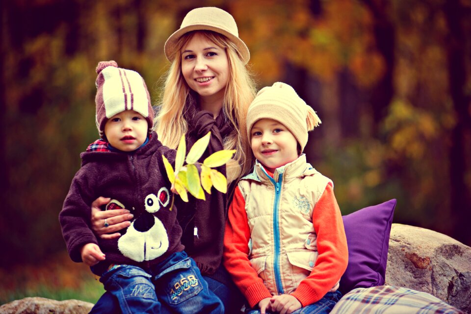 Mother with children autumn in the park