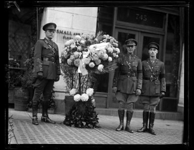 Military group with flower arrangement with tag Newfoundland LCCN2016890943