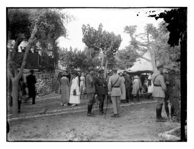 Military officials amd women outdoors near tent, possibly at fete for Y.W.C.A. LOC matpc.11730