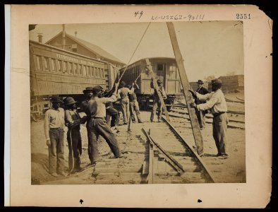 Military railroad operations in northern Virginia- men using levers for loosening rails LCCN97502026