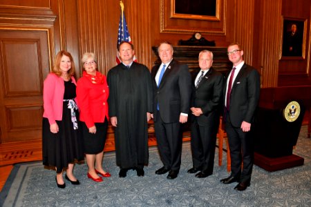 Mike Pompeo and John Sullivan pose for a photo with Samuel Alito