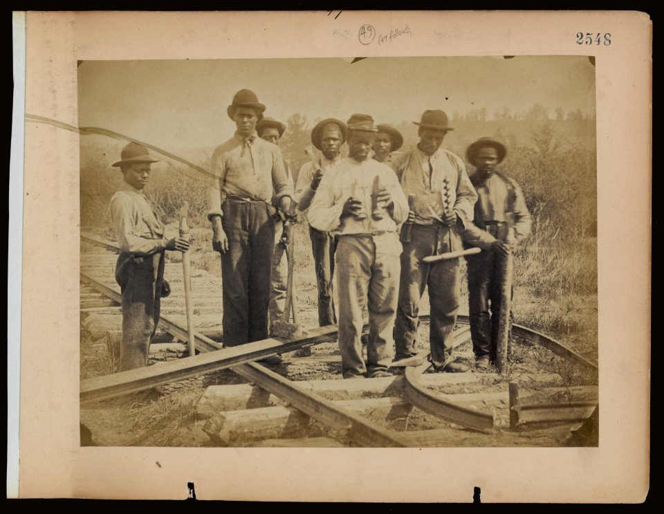 Military railroad operations in northern Virginia- men standing on railroad track LCCN2006676176