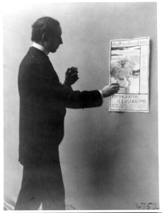 Mills Thompson, three-quarter length portrait, standing, drawing Frances Benjamin Johnston business poster LCCN2001703938