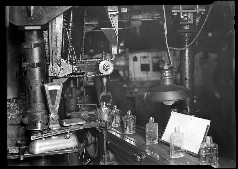 Millville, New Jersey - Glass bottles. (Bottles moving along a conveyor belt.) - NARA - 518672