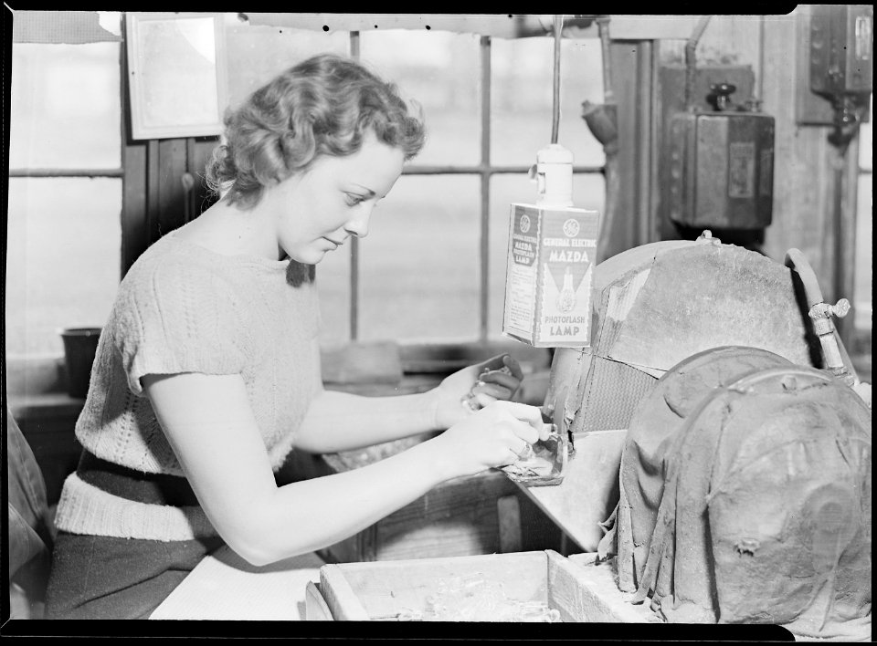Millville, New Jersey - Glass bottles. A skilled worker at T.C. Wheaton grinding glass stoppers for glass bottles. An... - NARA - 518631