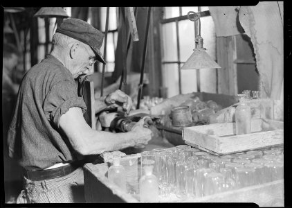 Millville, New Jersey - Glass bottles. T.C. Wheaton Co. A bottle with the stopper may be seen directly in the lower... - NARA - 518635