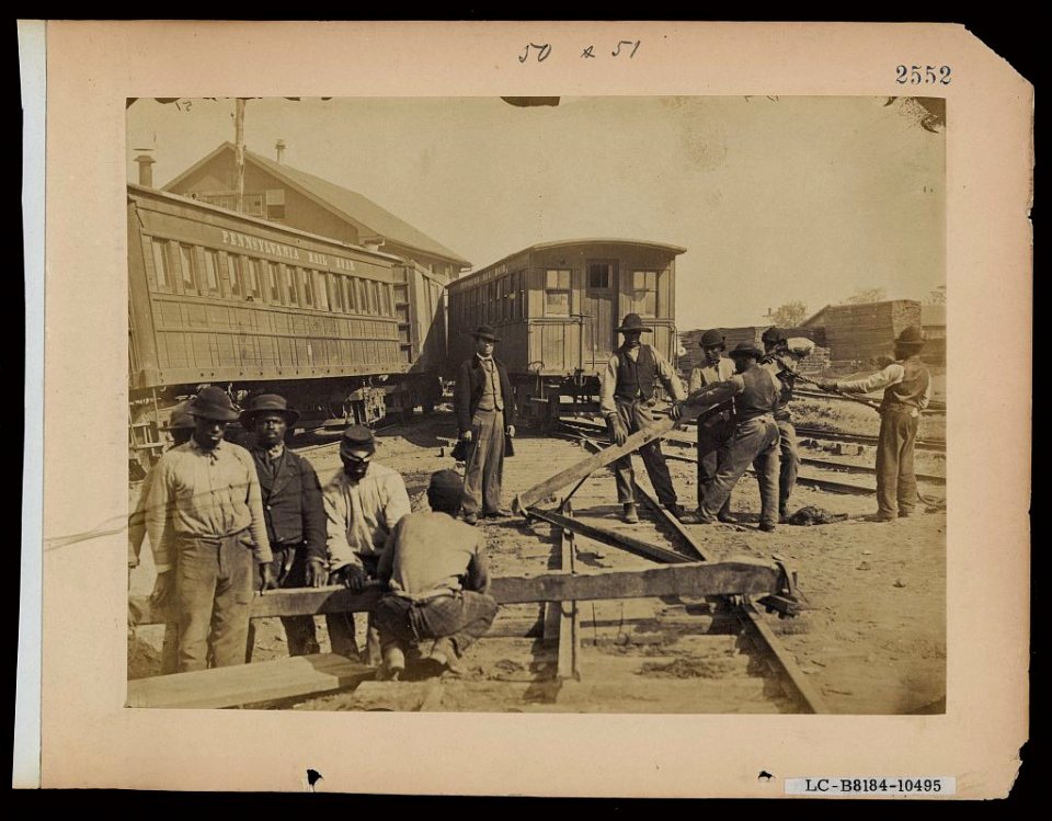 Military railroad operations in northern Virginia- men using levers for loosening rails LCCN2006676177