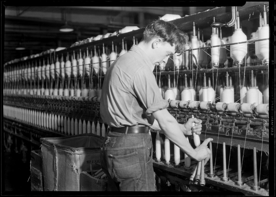 Millville, New Jersey - Textiles. Millville Manufacturing Co. (Man fixing machine.) - NARA - 518680