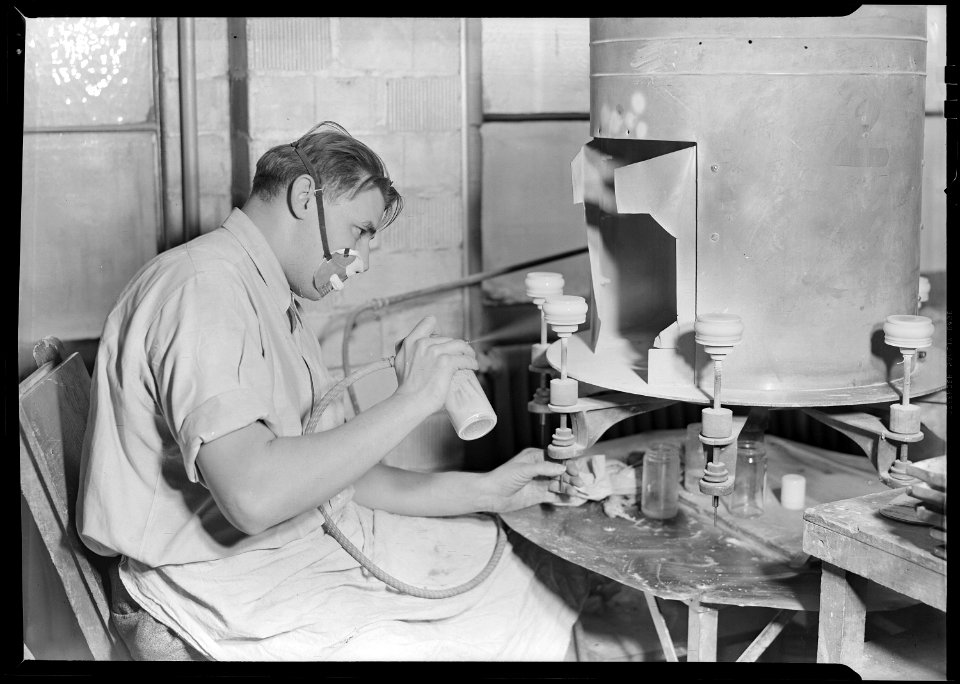 Millville, New Jersey - Glass bottles. Paint sprayer, T. C. Wheaton Co. art room. This man is spraying white glass... - NARA - 518632