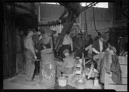 Millville, New Jersey - Glass bottles. T.C. Wheaton Co. Men working in shop. - NARA - 518644