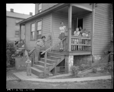 Miner's family on porch of company home. H. C. Frick Coke Company, National ^3 Mine, Muse, Washington County... - NARA - 540327