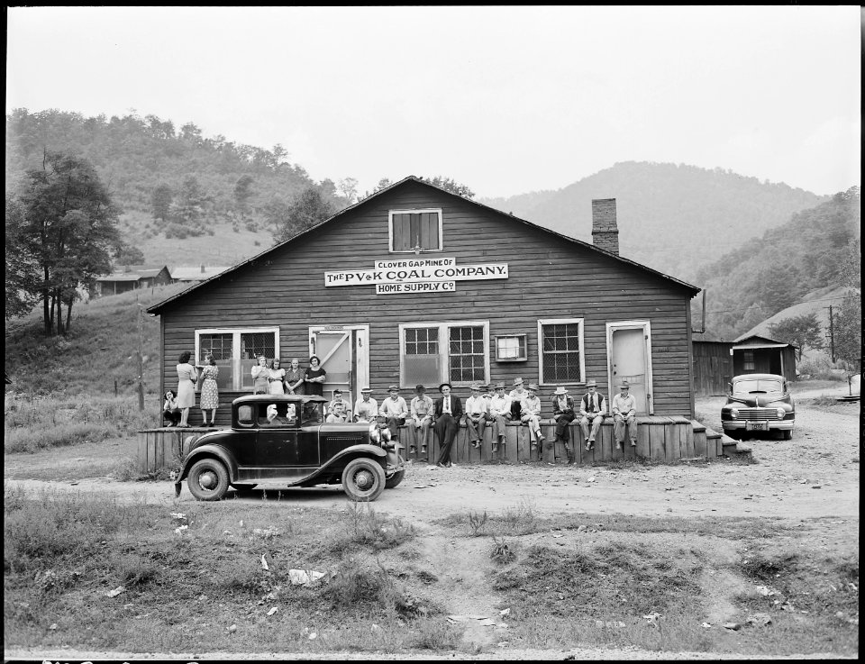 Miners and their families gather around the community store and office. P V & K Coal Company, Clover Gap Mine... - NARA - 541327
