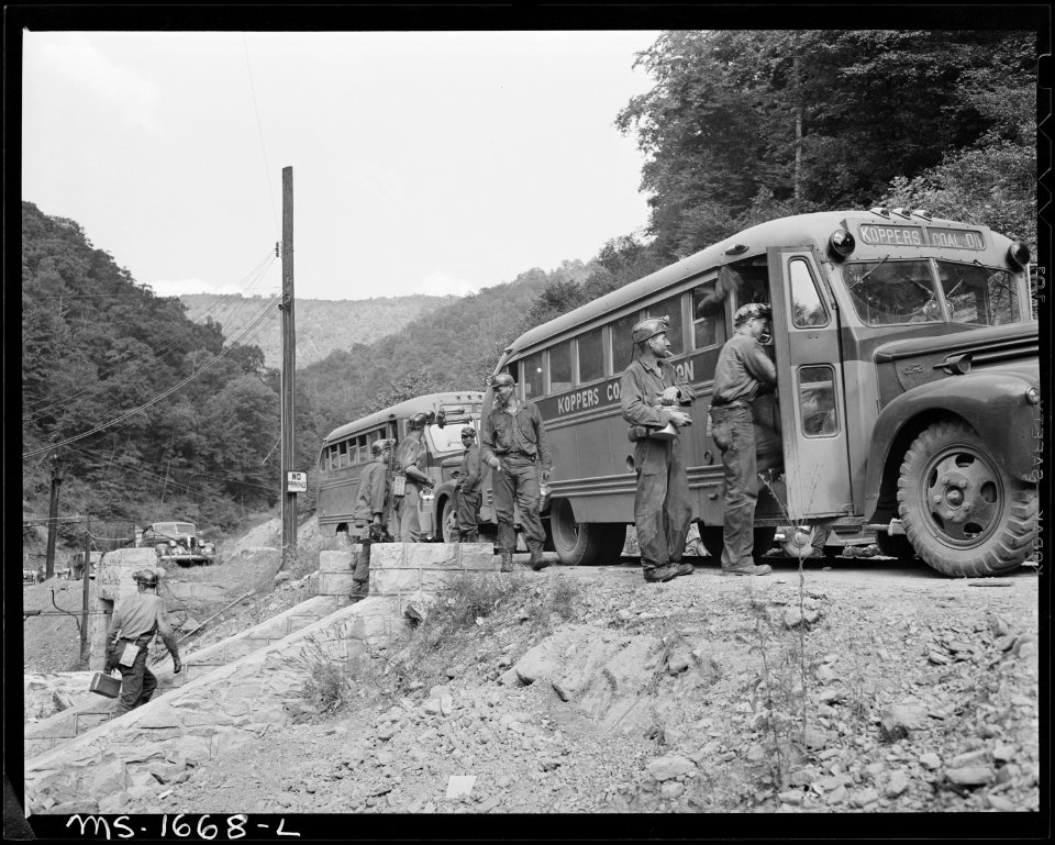 Miners boarding buses which will take them to washhouse from lamp house where they have checked out. Koppers Coal... - NARA - 540901