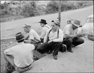 Miners waiting for the bus to take them to Richlands after they have washed up at the bathouse. Jewell Ridge Coal... - NARA - 540694