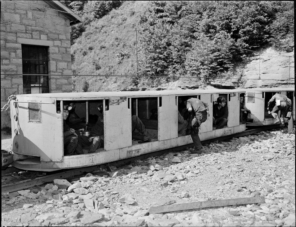 Miners boarding cars of man trip just before going underground on afternoon shift. Koppers Coal Division, Kopperston... - NARA - 540929