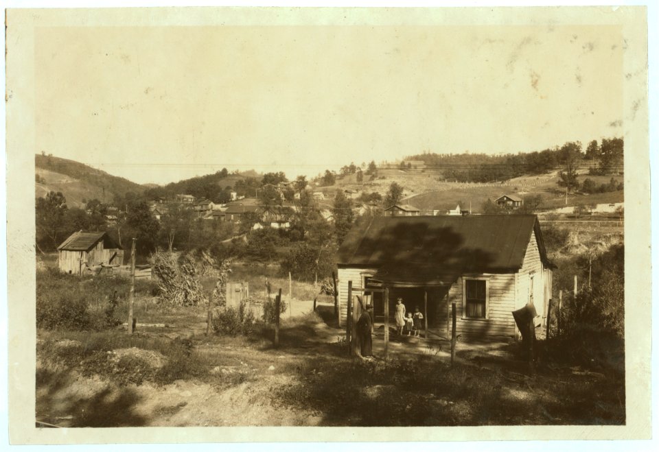 Miners cabins on the Elk River at Bream, W. Va. near Charleston. Others on slope beyond. A typical mining community here. Children go to Big Chimney school. Oct. 10, 1921. LOC nclc.04406