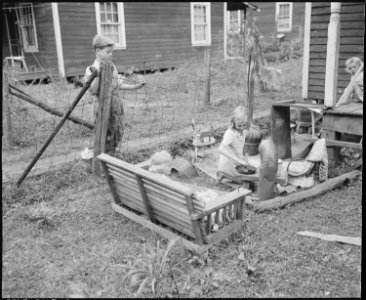 Miners children playing in their front yard. Raven Red Ash Coal Company, No. 2 Mine, Raven, Tazewell County, Virginia. - NARA - 541113