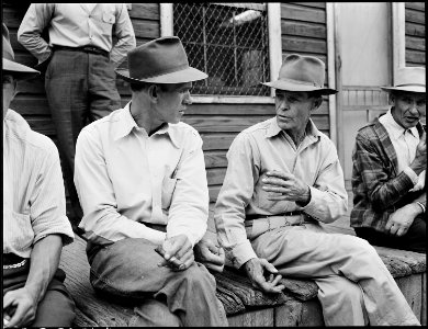 Miners on the front porch of the company store on a Sunday morning payday. P V & K Coal Company, Clover Gap Mine... - NARA - 541328