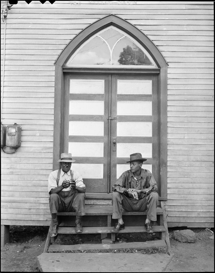 Miners sitting in front of church. Mullens Smokeless Coal Company, Mullens Mine, Harmco, Wyoming County, West Virginia. - NARA - 540938