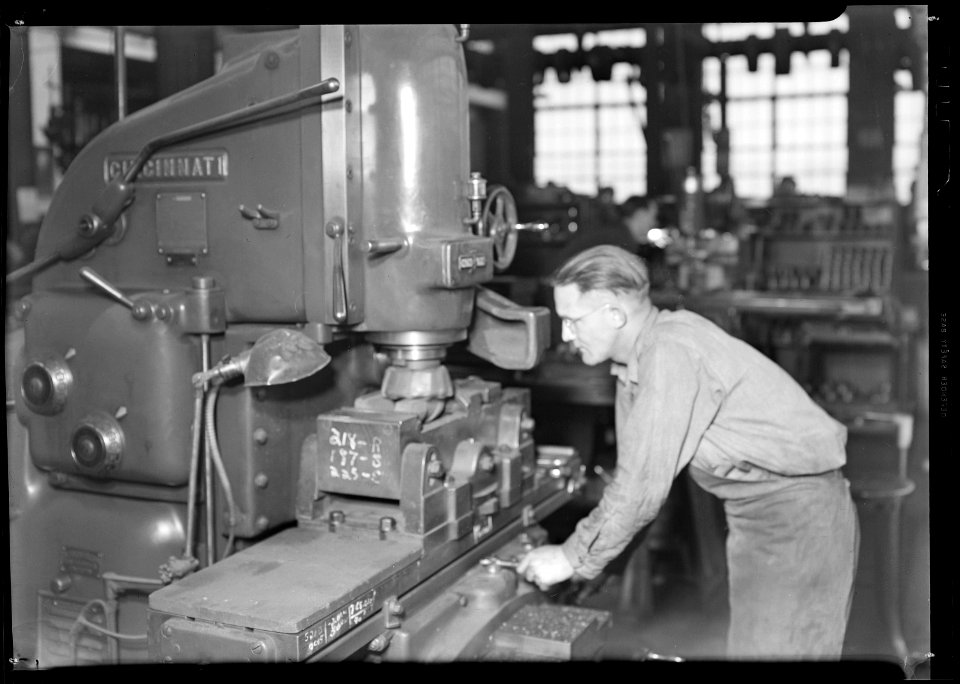Millville, New Jersey - Glass bottles. Mould shop Whitall Tatum Co. This skilled machinist is running a machine which... - NARA - 518655