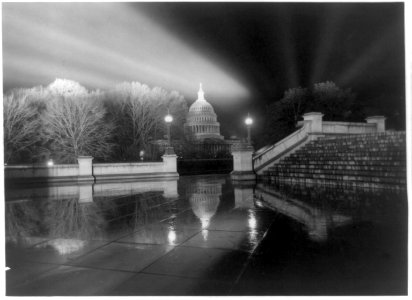 Night view in rain (of Capitol) taken from steps (Neptune Plaza) of Library of Congress LCCN91785938