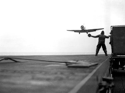 North American SNJ-3 landing aboard USS Wolverine (IX-64), in January 1943 (80-G-34356)