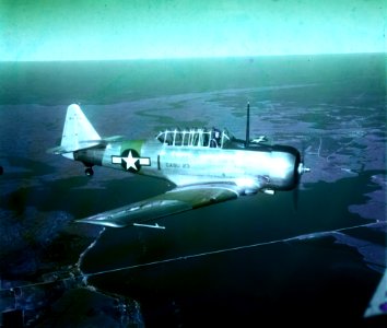 North American SNJ-5 Texan in flight near Naval Air Station Atlantic City, New Jersey (USA), circa in 1945 (S-094.01)