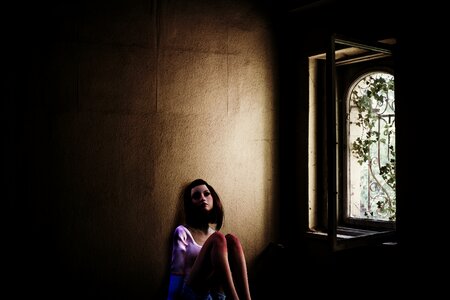 Woman window incidence of light photo