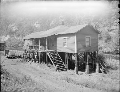 Notice foundation posts of this typical house. Southern Coal Corporation, Bradshaw Mine, Bradshaw, McDowell County... - NARA - 541051