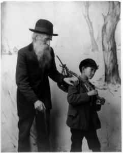 Old bearded man with hand on the Asian boy's shoulder LCCN2003675189