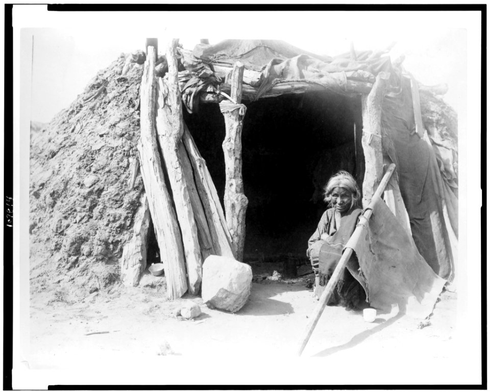 Old Navajo Indian seated in doorway of hogan LCCN93505931